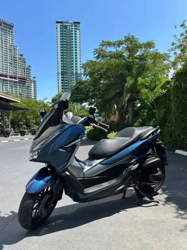 Honda Forza 300i 2020 for rent in Pattaya – full view with background buildings