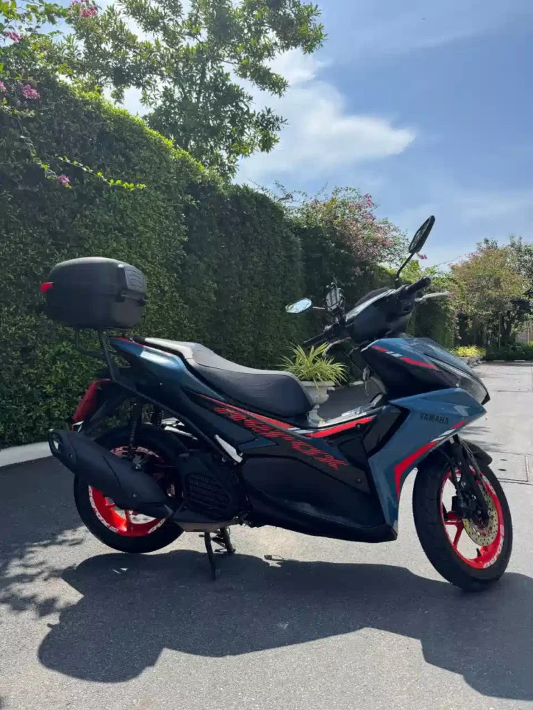 Yamaha Aerox rental Pattaya scooter with top box parked outdoors